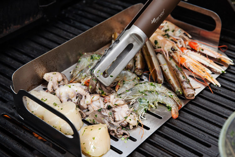 Place all the seafood except for the calamari on the preheated grill topper and cook for about 2 - 3 minutes on each side or until done. (Make sure that any clams or mussels open during cooking and to discard any that do not open!)